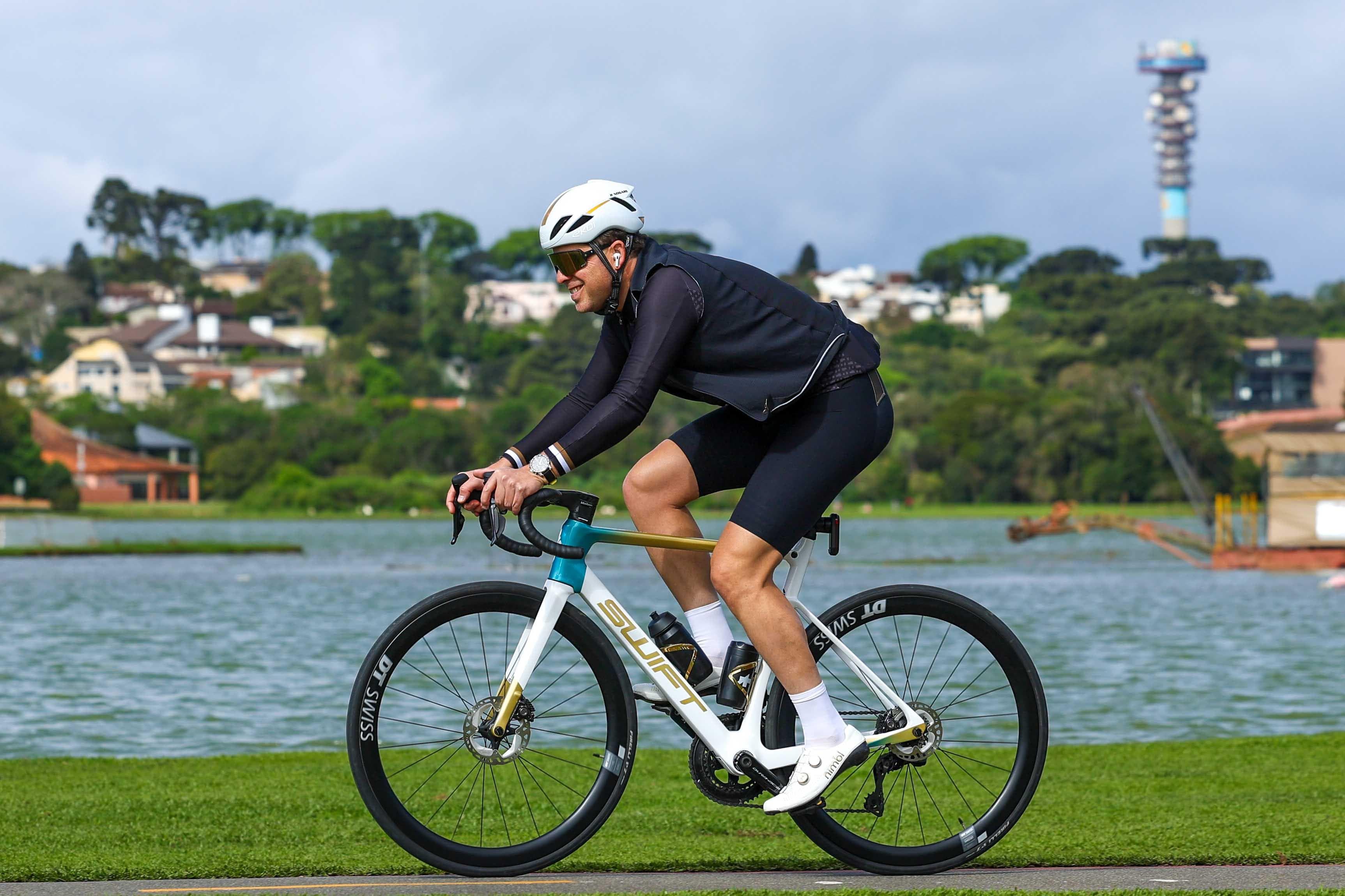 Cyclist riding a SWIFT bike through a natural landscape